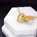 Collier de cœurs entrelacés - Variantes en or jaune et blanc